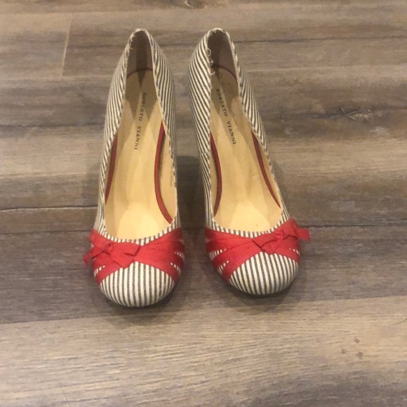 Gently worn striped shoes with Red bow detailing